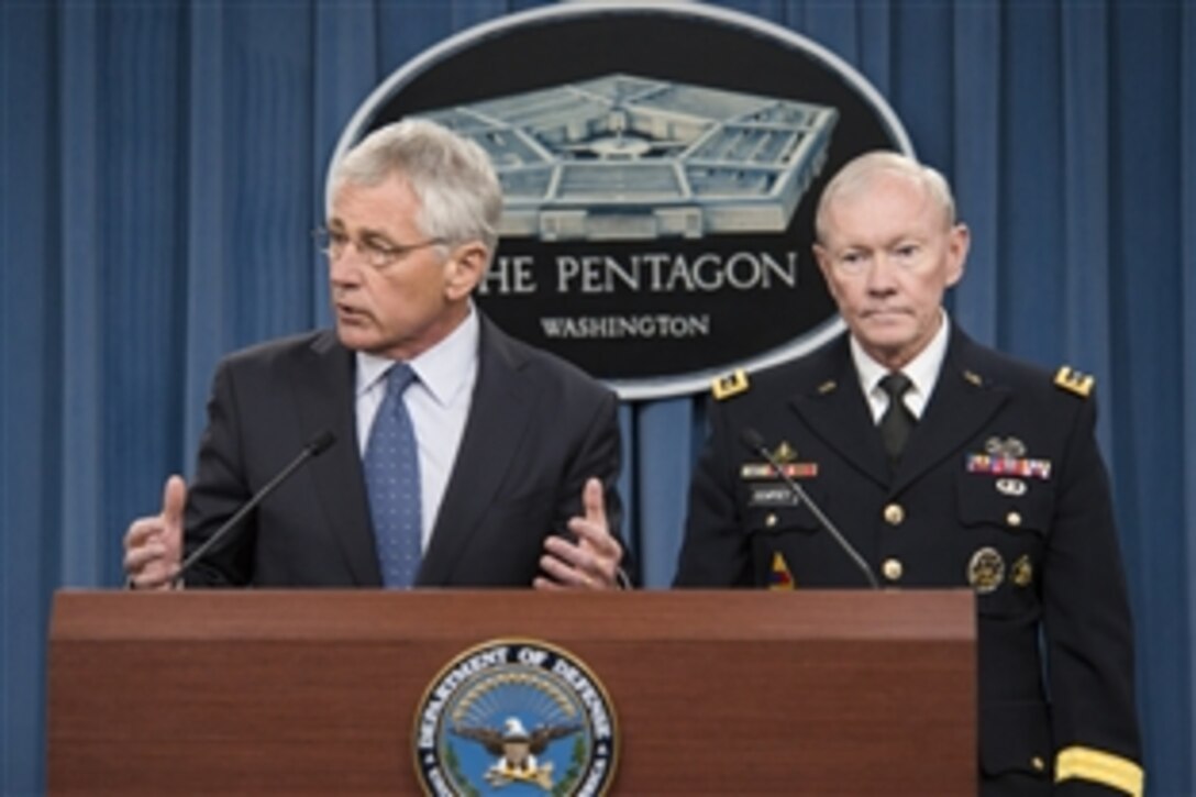 Defense Secretary Chuck Hagel and Army Gen. Martin E. Dempsey, chairman of the Joint Chiefs of Staff, brief reporters on the fiscal year 2015 defense budget proposal at the Pentagon, Feb. 24, 2014.