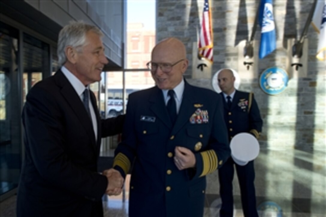 Defense Secretary Chuck Hagel greets Coast Guard Commandant Adm. Robert J. Papp Jr. before a meeting with the council of governors at Coast Guard headquarters at the former St. Elizabeths Hospital site in Washington, D.C., Feb. 24, 2014. Hagel and senior Defense Department leaders met to discuss upcoming budget recommendations.