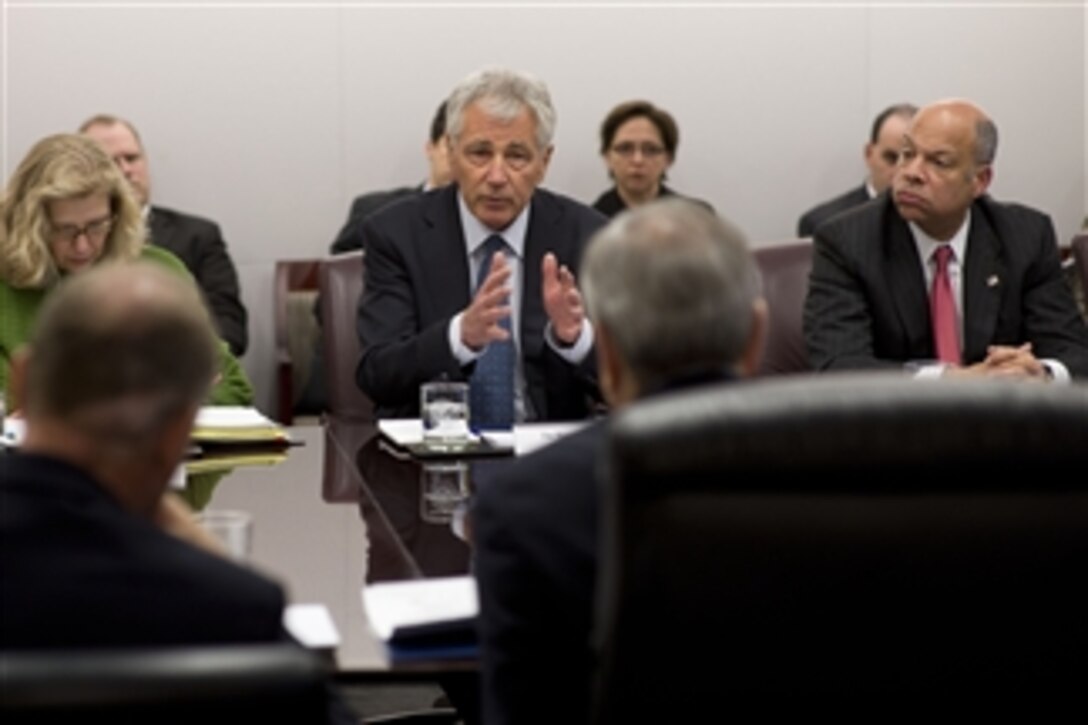 Defense Secretary Chuck Hagel, center, meets with the council of governors at Coast Guard headquarters at the former St. Elizabeths Hospital site in Washington, D.C., Feb. 24, 2014. Hagel and senior Defense Department leaders met to discuss upcoming budget recommendations.