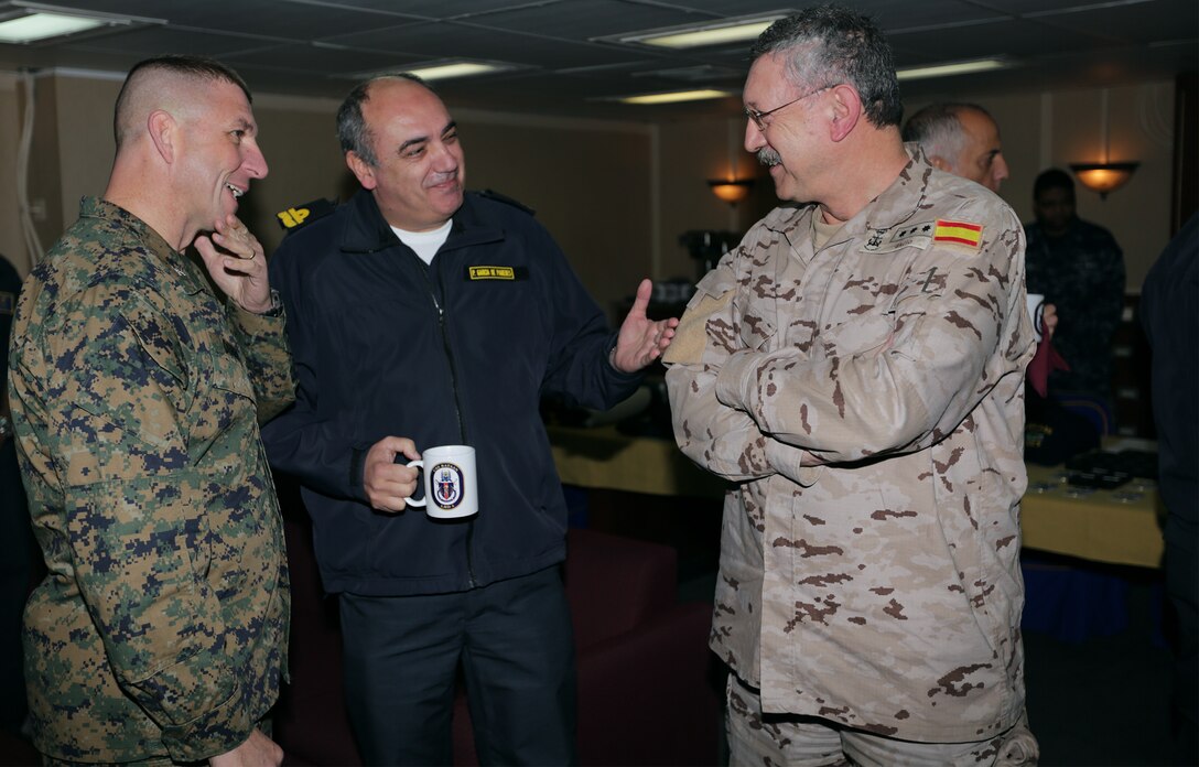 U.S. Marine Corps Col. William Dunn (left), 22nd Marine Expeditionary Unit (MEU) commanding officer, speaks with Portuguese and Spanish military leaders during a visit aboard the USS Bataan (LHD 5), at sea, Feb. 23, 2014. The MEU is deployed to the U.S. 6th Fleet area of responsibility with the Bataan Amphibious Ready Group as a sea-based, expeditionary crisis response force capable of conducting amphibious missions across the full range of military operations. (U.S. Marine Corps photo by GySgt Freddy G. Cantu/Released)