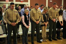 Brig. Gen. Edward D. Banta (right), the commanding general of 2nd Marine Logistics Group, II Marine Expeditionary Force, Col. Gary F. Keim (center), the commanding officer of Combat Logistics Regiment 27, 2nd MLG, II MEF, and Sgt. Maj. Joe R. DePoyster, the regimental sergeant major for CLR-27, bow their heads during a prayer in a change of command ceremony at Marston Pavilion aboard Camp Lejeune, N.C., Feb. 21, 2014. The change of command ceremony was the exchange of command between Lt. Col. Kevin G. Collins, the outgoing commanding officer and Lt. Col. Daniel H. Coleman, the incoming CO of Combat Logistics Battalion 26, CLR-27, 2nd MLG.