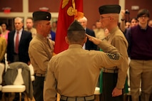 Sgt. Maj. Phillip J. Billiot (center), the sergeant major of Combat Logistics Battalion 26, Combat Logistics Regiment 27, 2nd Marine Logistics Group, salutes Lt. Col. Kevin G. Collins, the outgoing commanding officer and Lt. Col. Daniel H. Coleman, the incoming CO of the battalion during a change of command ceremony at Marston Pavilion aboard Camp Lejeune, N.C., Feb. 21, 2014. The passing of the flag symbolizes the passing of responsibility between commanding officers. 