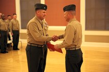 Col. Gary F. Keim (left), the commanding officer of Combat Logistics Regiment 27, 2nd Marine Logistics Group, II Marine Expeditionary Force, shakes hands with Lt. Col. Kevin G. Collins (right), the outgoing commanding officer of Combat Logistics Battalion 26, CLR-27, 2nd MLG, during a change of command ceremony at Marston Pavilion aboard Camp Lejeune, N.C., Feb. 21, 2014. During the ceremony, Collins received the Legion of Merit Medal 2nd Award for recognition of his outstanding leadership while in command of CLB-26. 