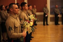 Marines with Combat Logistics Battalion 26, Combat Logistics Regiment 27, 2nd Marine Logistics Group hold flowers during a change of command ceremony at Marston Pavilion aboard Camp Lejeune, N.C., Feb. 21, 2014. During a change of command ceremony, flowers are given to the spouses of the commanding officers.