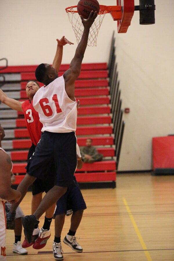 Aaron Bonner , Marine Corps Systems Command team member, attempts to score during a game against the Marine Corps Embassy Security Guard team at the Barber Physical Activities Center on Feb. 19, 2014. MCSC won the game 68-27. 