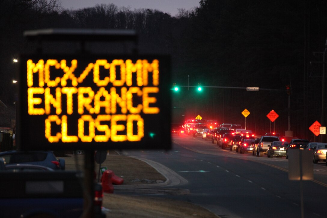 On the morning of Feb. 25, a sign alerts drivers of the impending closure of the entrances to the exchange and commissary parking lot. Beginning Feb. 28, barriers will be in place from 5 to 8:30 a.m. every morning to prevent drivers stuck in Russell Road traffic from cutting through the lot. 