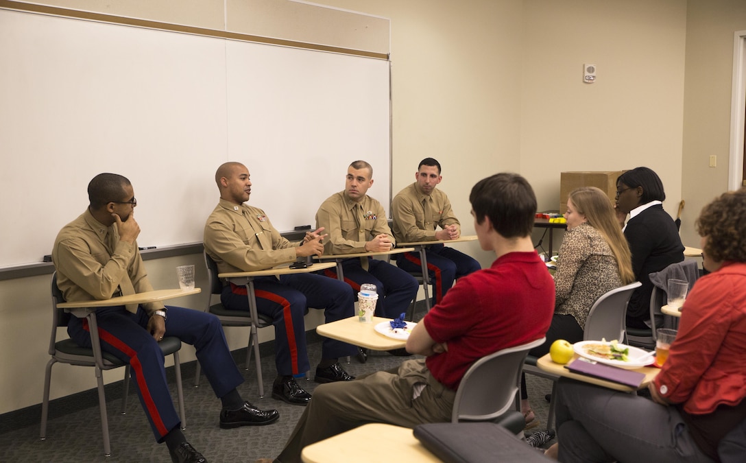 (Left to right) Captains Jordan Harris, Orlando Ashworth, Craig Thomas and 2nd Lt. Christopher Perino answer questions during a panel discussion at the Marine Corps Leadership Seminar (MCLS), at Virginia Commonwealth University, here, Feb. 21. The MCLS is a program designed to spread awareness of the Marine Corps as well as teach college students valuable leadership traits and characteristics.