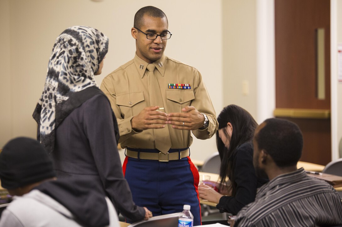 Captain Jordan Harris, an instructor for the Marine Corps Leadership Seminar(MCLS), interacts with students during a break at the MCLS, Virginia Commenwealth University, here, Feb. 21. The MCLS is a program designed to spread awareness of the Marine Corps as well as teach college students valuable leadership traits and characteristics. 