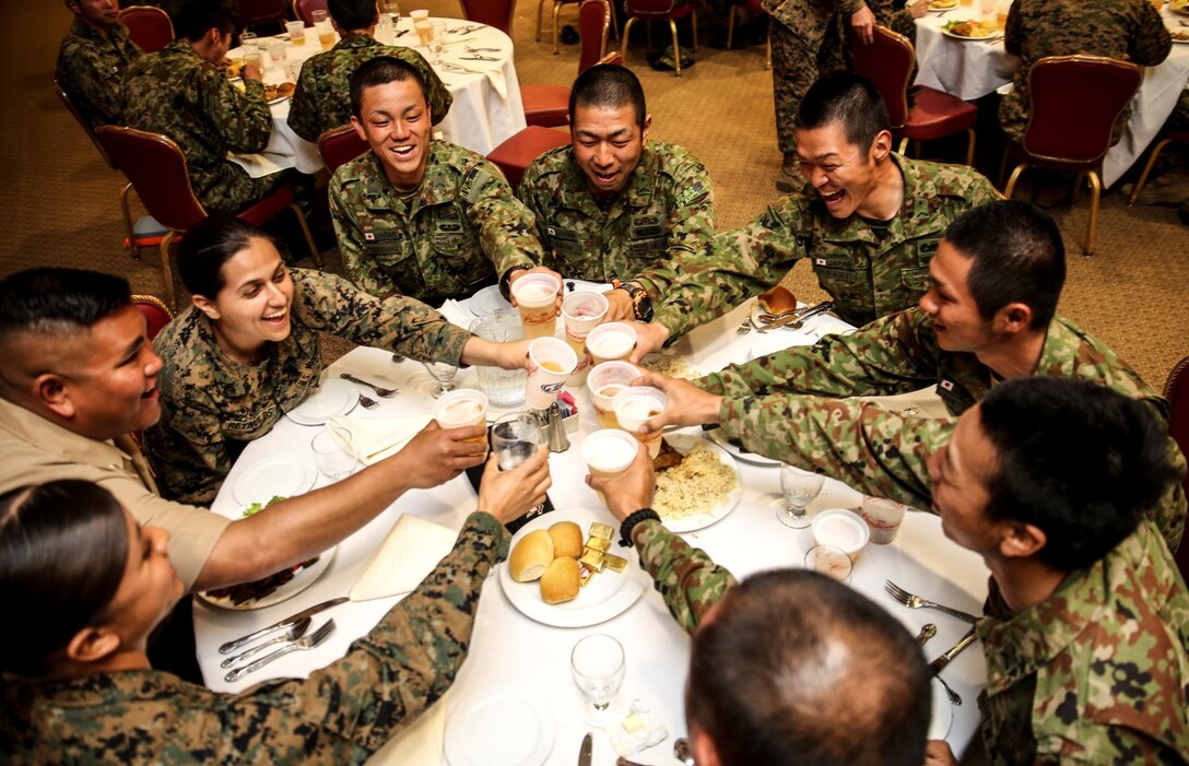 U.S. Marines and sailors and soldiers with the Japan Ground Self-Defense Force toast at the closing ceremony for Exercise Iron Fist 2014 aboard Camp Pendleton, Calif., Feb. 24, 2014. Iron Fist is an amphibious exercise that brings together Marines and sailors from the 15th MEU, other I Marine Expeditionary Force units, and soldiers from the JGSDF, to promote military interoperability and hone individual and small-unit skills through challenging, complex and realistic training. (U.S. Marine Corps photo by Cpl. Emmanuel Ramos/Released)