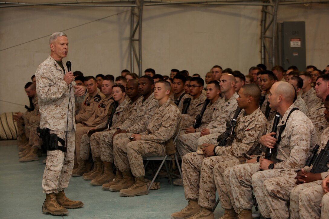 General James F. Amos, commandant of the Marine Corps, addresses Marines and sailors at a town hall meeting aboard Camp Leatherneck, Helmand province, Afghanistan, Feb. 18, 2014. General Amos and Sgt. Maj. Micheal P. Barrett, sergeant major of the Marine Corps, spoke with the Marines about the future of the Marine Corps, the reawakening of the Corps and thanked them for their hard work.
