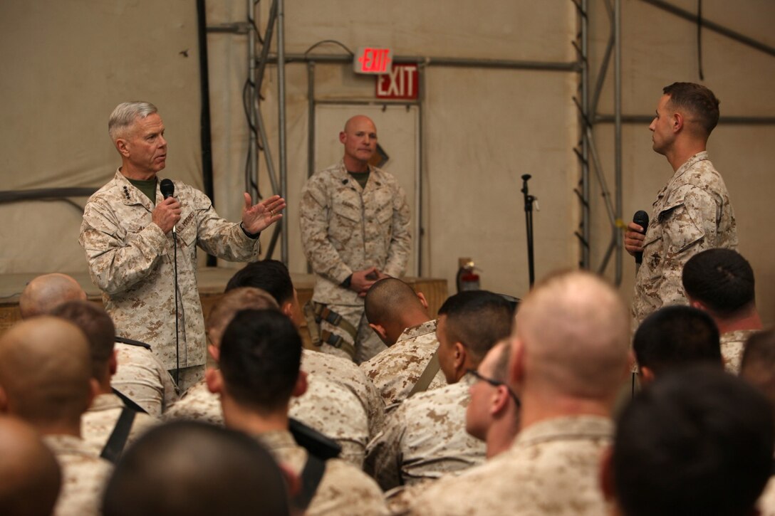 General James F. Amos, left, commandant of the Marine Corps, answers a question about rotational force structure during a town hall meeting held aboard Camp Leatherneck, Helmand province, Afghanistan, Feb. 18, 2014. General Amos and Sgt. Maj. Micheal P. Barrett, sergeant major of the Marine Corps, visited with Marines and sailors of Regional Command (Southwest) to speak about the peacetime Marine Corps force and the reawakening of the Corps.