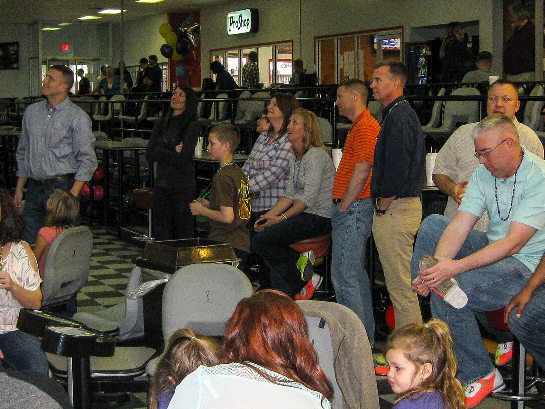 U.S. Marines and Sailors from the 26th Marine Expeditionary Unit (MEU) brought their families to Bonnyman Bowling Center aboard Camp Lejeune, N.C., for a Mardi Gras party Feb. 22, 2014. The MEU family readiness officer coordinated the event to promote camaraderie among the unit. (U.S. Marine Corps photo by Staff Sgt. Edward Guevara/Released)