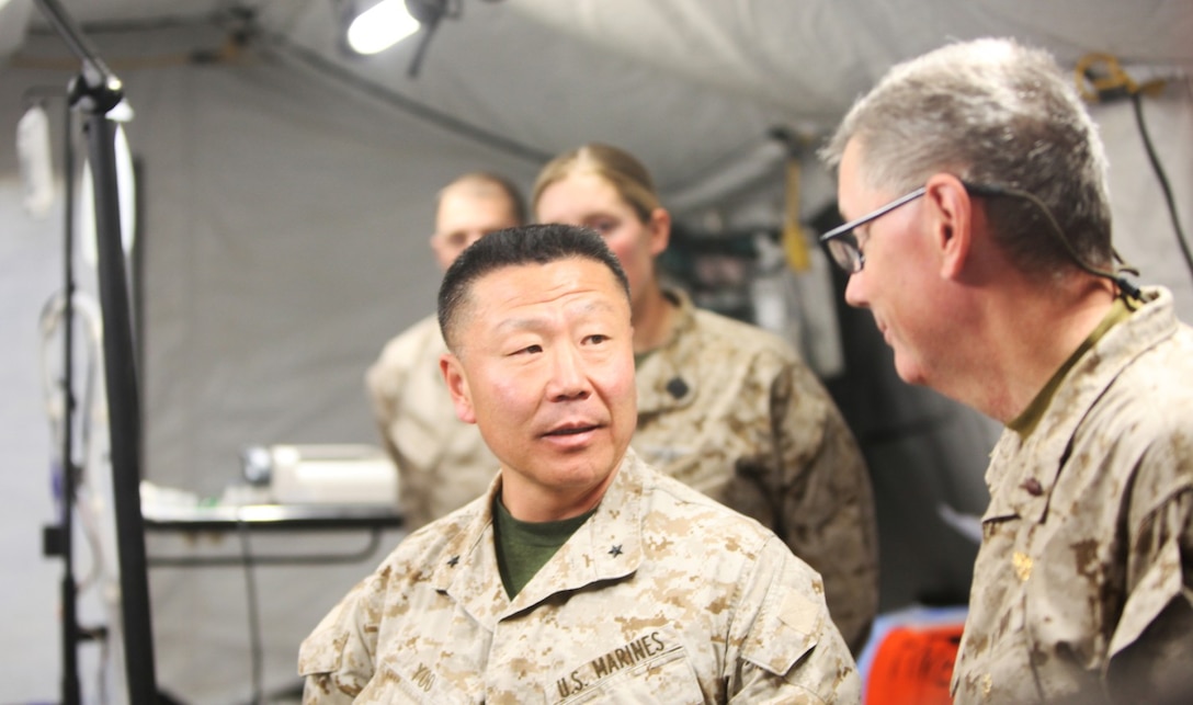 Brigadier Gen. Daniel D. Yoo, commanding general of Regional Command (Southwest), talks to emergency physicians with Alpha Surgical Company, Combat Logistics Battalion 7, aboard Camp Leatherneck, Helmand province, Afghanistan, Feb. 15, 2014. Brigadier Gen. Yoo expressed how impressed he was with the skills and confidence of the emergency surgeons, nurses, independent duty corpsmen and field medic corpsmen operating aboard Camp Leatherneck and throughout Helmand province. (U.S. Marine Corps photo by Cpl. Cody Haas/ Released)