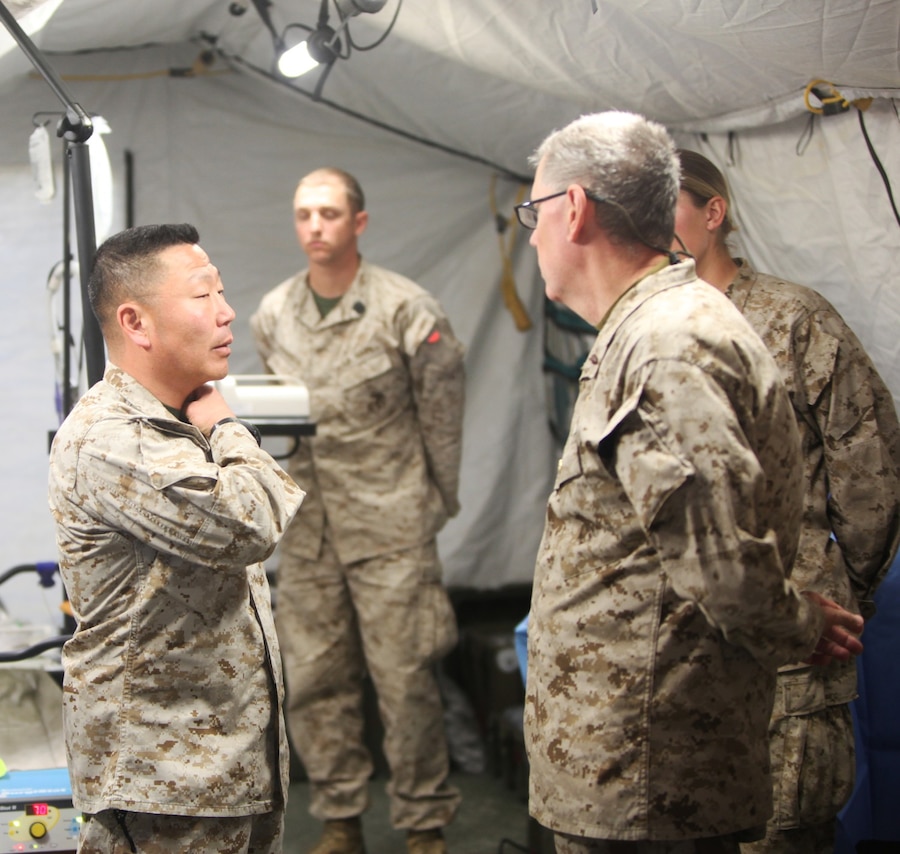 Brigadier Gen. Daniel D. Yoo, commanding general of Regional Command (Southwest), talks to emergency physicians with Alpha Surgical Company, Combat Logistics Battalion 7, aboard Camp Leatherneck, Helmand province, Afghanistan, Feb. 15, 2014. Brigadier Gen. Yoo expressed how impressed he was with the skills and confidence of the emergency surgeons, nurses, independent duty corpsmen and field medic corpsmen operating aboard Camp Leatherneck and throughout Helmand province. (U.S. Marine Corps photo by Cpl. Cody Haas/ Released)