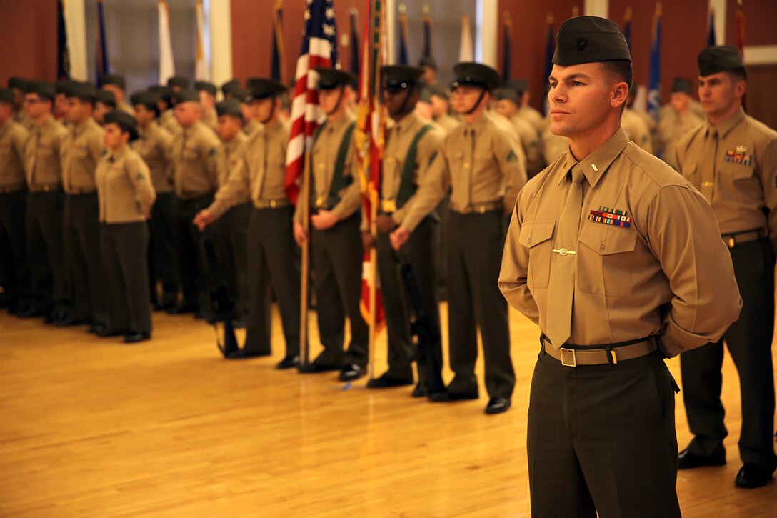 2nd Lt. Billy Van Vianen (right), a Sterling Heights, Mich., native, and a logistics officer with Combat Logistics Battalion 26, Combat Logistics Regiment 27, 2nd Marine Logistics Group stands at parade rest during a change of command ceremony at Marston Pavilion aboard Camp Lejeune, N.C., Feb. 21, 2014. The change of command ceremony was the exchange of command between Lt. Col. Kevin G. Collins, the outgoing commanding officer and Lt. Col. Daniel H. Coleman, the incoming CO.