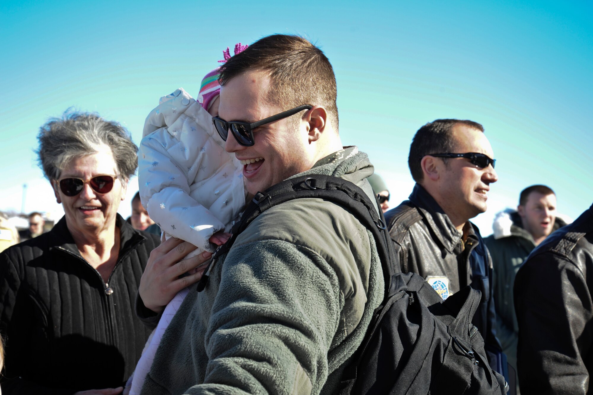 Staff Sgt. Isaac Bucklin, 92nd Aircraft Maintenance Squadron crew chief, returns home from Transit Center at Manas, Kyrgystan, for the last time at Fairchild Air Force Base, Wash., Feb. 25, 2014. According to Col. Newberry, 92nd Air Refueling Wing commander, the 92nd ARW will never forget the sacrifices made by the Team Fairchild family. (U.S. Air Force photo by Airman 1st Class Janelle Patiño/Released)