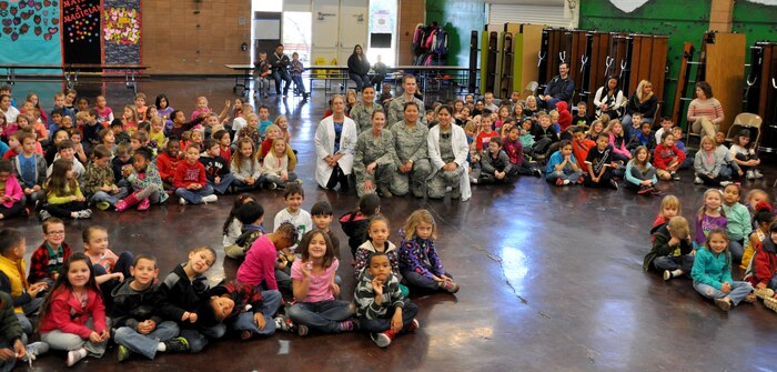 Members of the 9th Aerospace Medicine Squadron dental office pose for at picture with students of Lone Tree Elementary School at Beale Air Force Base, Calif., Feb. 20, 2014. February is National Children’s Dental Health Month. (U.S. Air Force photo by Staff Sgt. Robert M. Trujillo/Released)