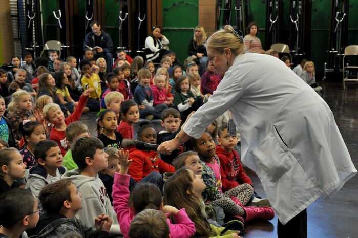 Lisa Latter, 9th Aerospace Medicine Squadron dental assistant, speaks to students of Lone Tree Elementary School about proper oral hygiene at Beale Air Force Base, Calif., Feb. 20, 2014. Members of the 9th AMDS also showed students how to brush and floss correctly. (U.S. Air Force photo by Staff Sgt. Robert M. Trujillo/Released)