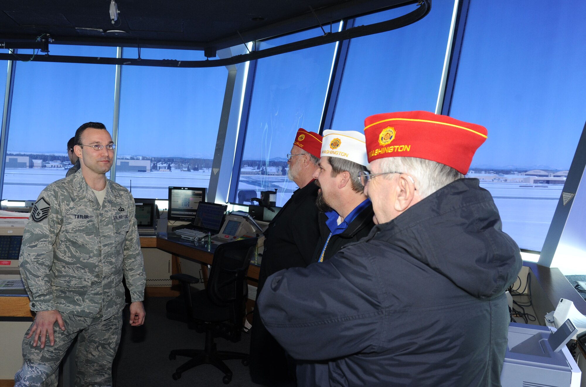 Master Sgt. Aaron Taylor, 92nd Operations Support Squadron tower chief controller, converses with members of the American Legion at the control tower at Fairchild Air Force Base, Wash., Feb. 25, 2014.  The American Legion is a lobbying organization that works on behalf of veterans.  (U.S. Air Force photo by Airman 1st Class Sam Fogleman/Released)