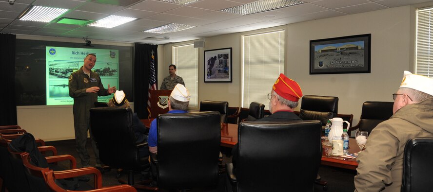 Col. Brian Newberry, 92nd Air Refueling Wing commander, gives a mission briefing to members of the national and Washington state levels of the American Legion in the wing conference room at Fairchild Air Force Base, Wash., Feb. 25, 2014.  The organization toured the base to gain a more thorough understanding of the mission at Fairchild.  (U.S. Air Force photo by Airman 1st Class Sam Fogleman/Released)
