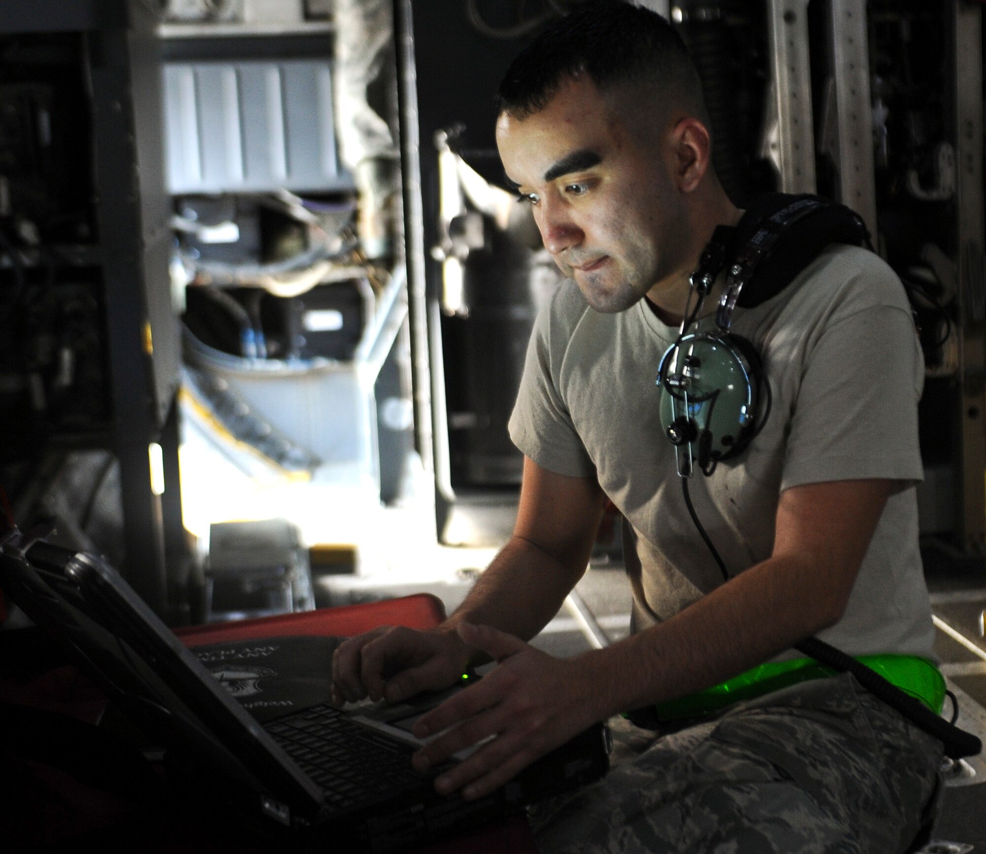 Airman 1st Class Adrian Ruiz, 1st Special Operations Equipment Maintenance Squadron crew chief, checks a technical order on the flightline at Hurlburt Field, Fla., Feb. 19, 2014. (U.S. Air Force photo/Senior Airman Michelle Vickers) 