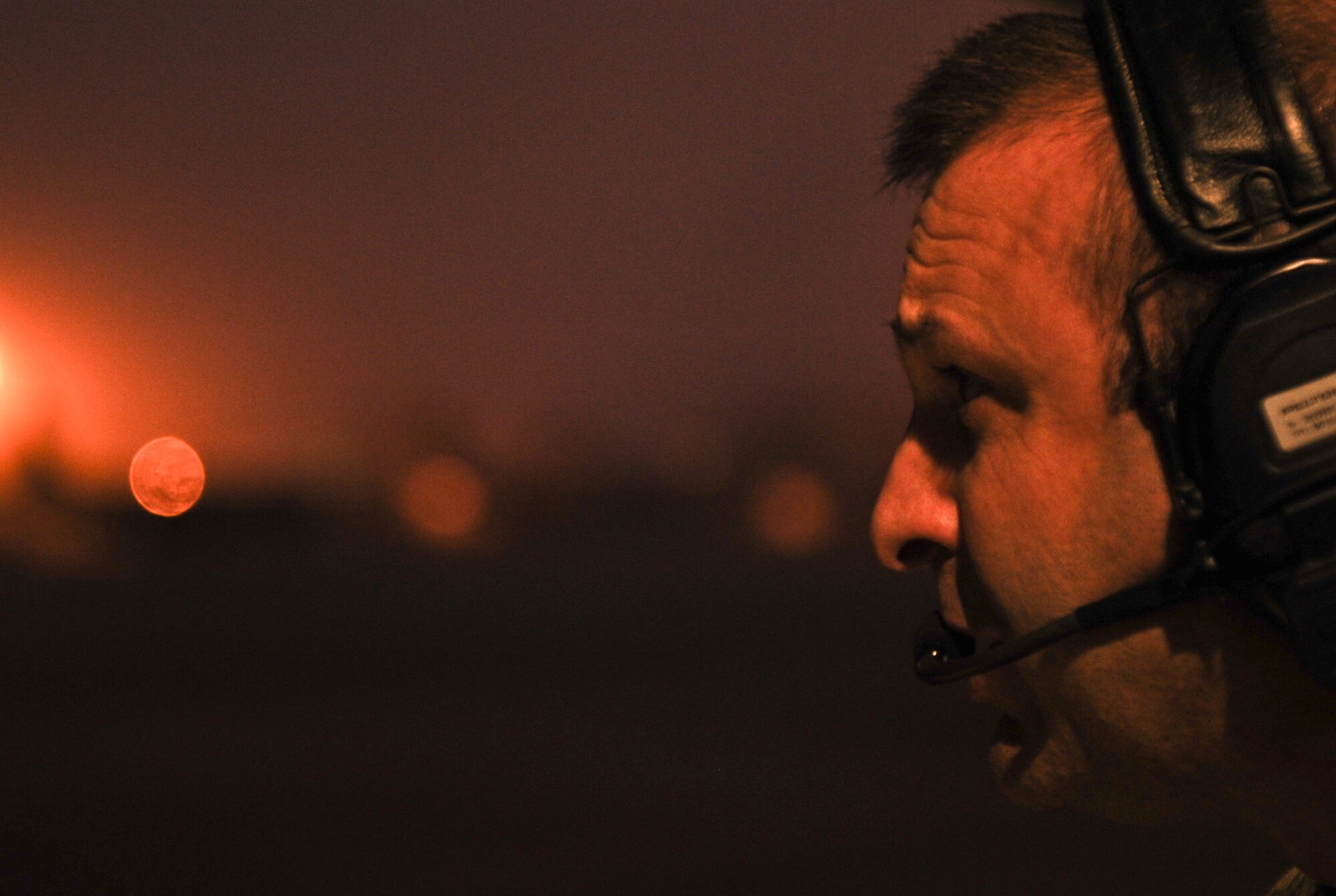 Master Sgt. Terry Wright, 15th Special Operations Squadron loadmaster, looks at weather conditions on the flightline at Hurlburt Field, Fla., Feb. 19, 2014. (U.S. Air Force photo/Senior Airman Michelle Vickers)