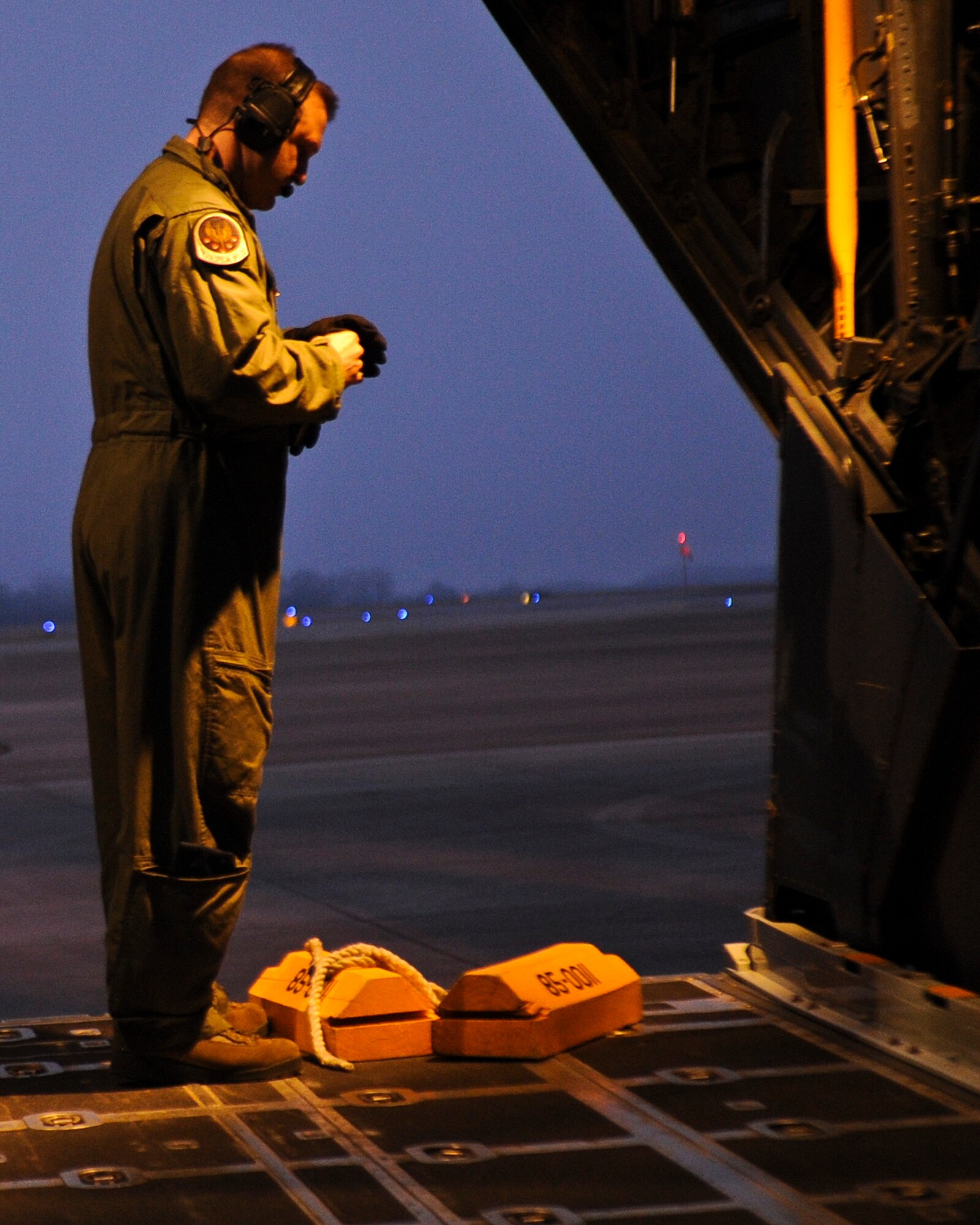 Master Sgt. Terry Wright, 15th Special Operations Squadron loadmaster, pulls chalks inside the aircraft on the flightline at Hurlburt Field, Fla., Feb. 19, 2014. (U.S. Air Force photo/Senior Airman Michelle Vickers)