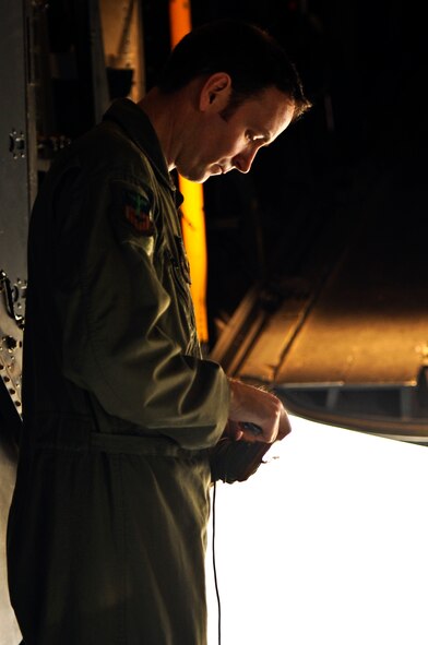 Master Sgt. Patrick Lehman, 15th Special Operations Squadron loadmaster, unwinds 550-cord on a MC-130H Combat Talon II on the flightline at Hurlburt Field, Fla., Feb. 19, 2014. (U.S. Air Force photo/Senior Airman Michelle Vickers)