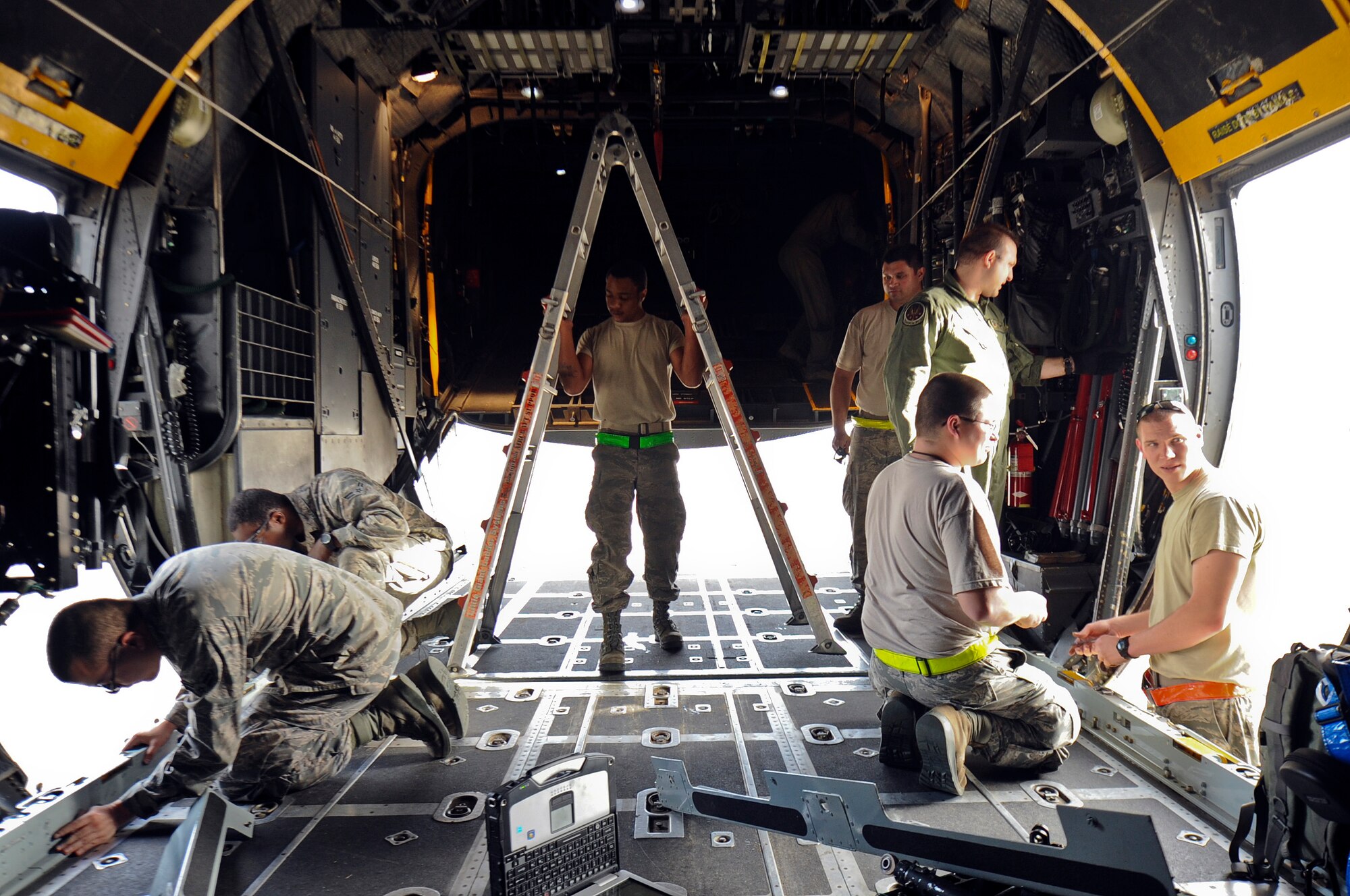 Maintainers reconfigure the load area of a MC-130H Combat Talon II on the flightline at Hurlburt Field, Fla., Feb. 19, 2014. (U.S. Air Force photo/Senior Airman Michelle Vickers)