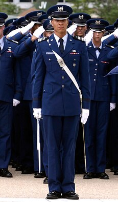Academy cadets salute during a ceremony Sept. 11, 2013. The Academy's Mosaic Character and Leadership Coaching Program was named the Jon C. Dalton Institute Best Practices award Feb. 6, for having the best practices of any college student program in the U.S.