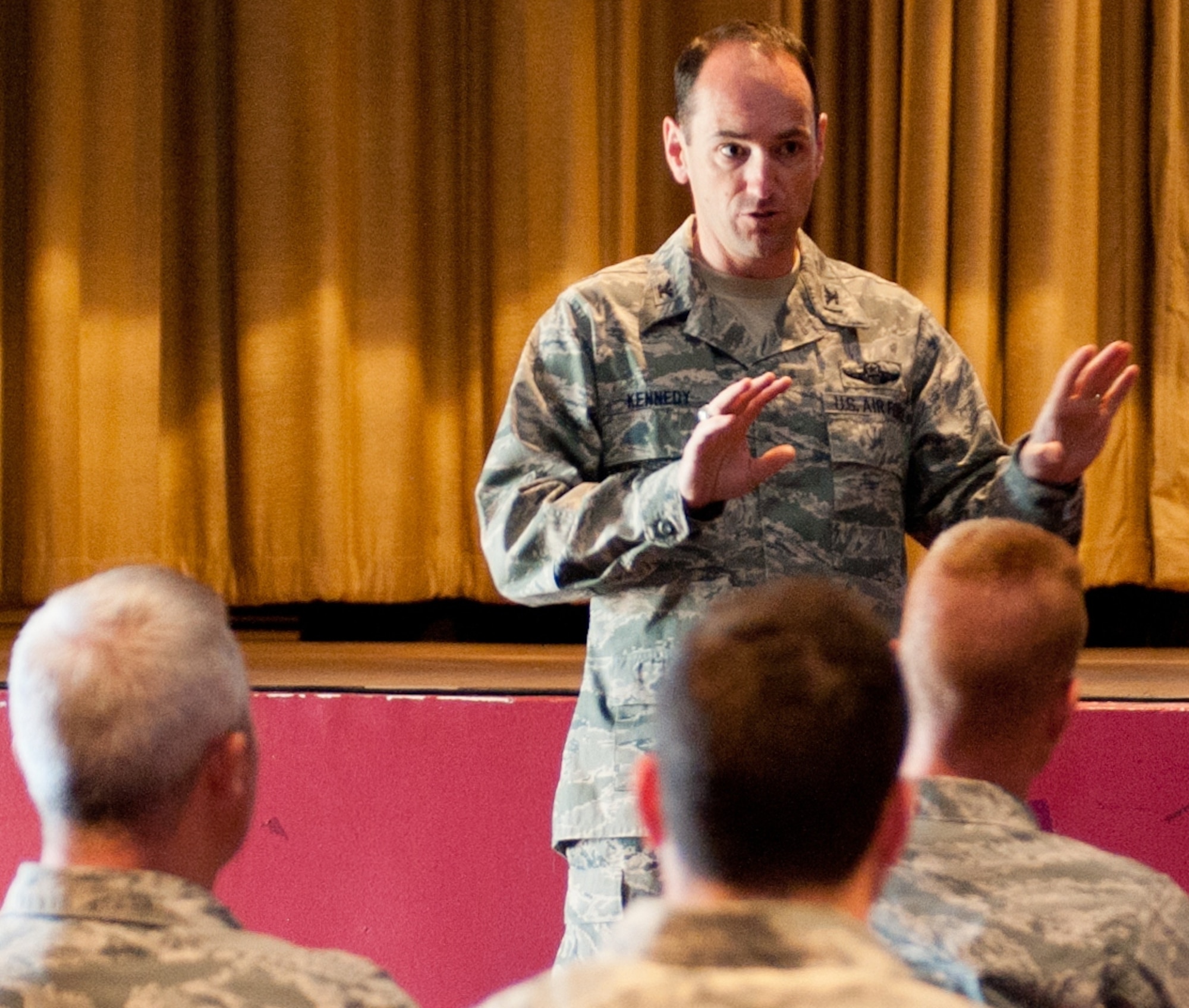 Col. Kevin Kennedy, 28th Bomb Wing commander, addressed his Airmen during a recent commander's call in the Base Theater at Ellsworth Air Force Base, S.D., May 6, 2013. Kennedy emphasized that good order and discipline is a command responsibility, however each member of the wing has a duty to foster a healthy climate and professional environment. (U.S. Air Force photo by Senior Airman Kate Maurer/Released)