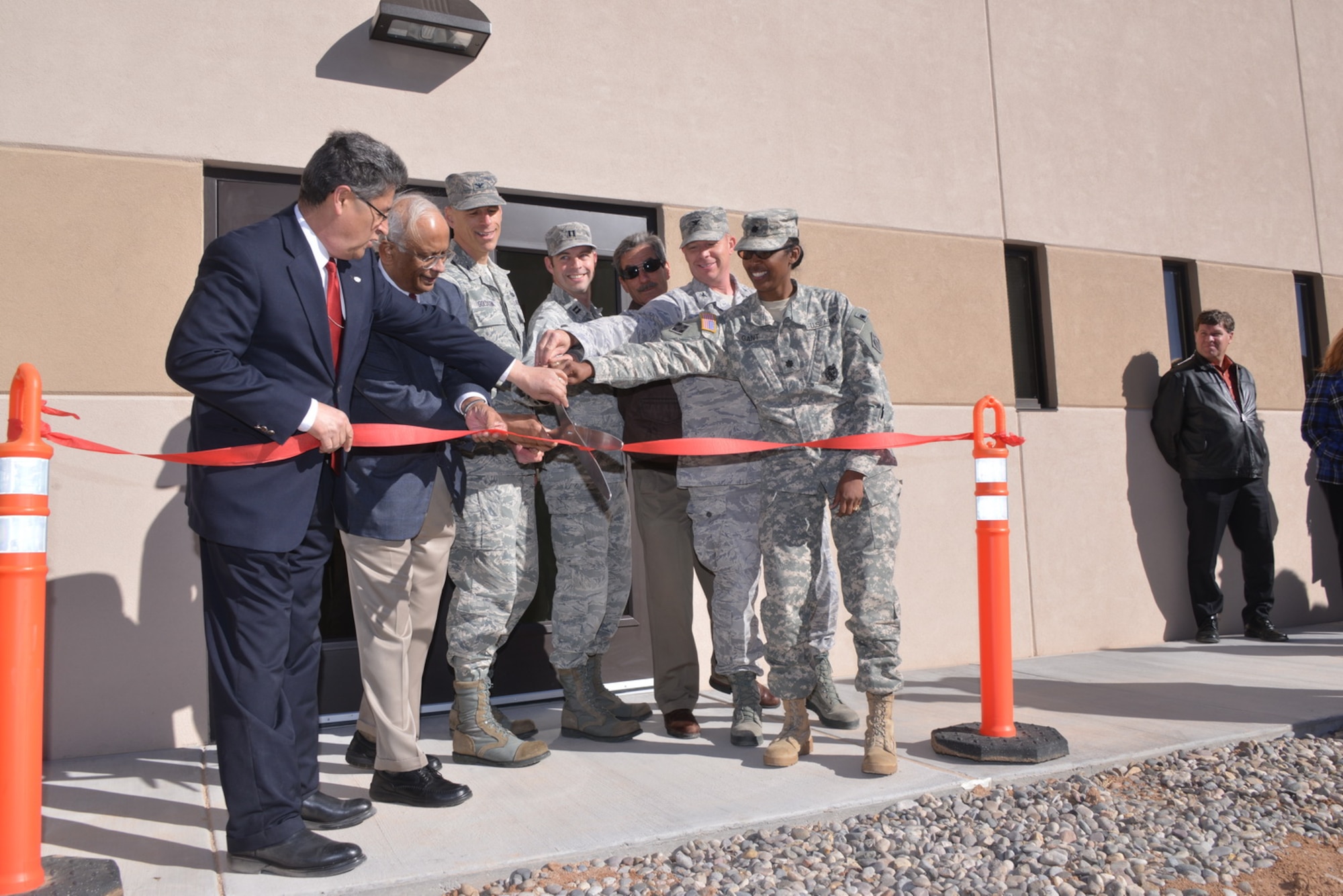 Air Force Reseach Laboratory senior leaders cut the ribbon for the Infrared Radiation Effects Laboratory, the newest AFRL building. The IRREL houses the capability for performing and evaluating maturing radiation technology for space-based platforms. (Photo by Todd Berenger)