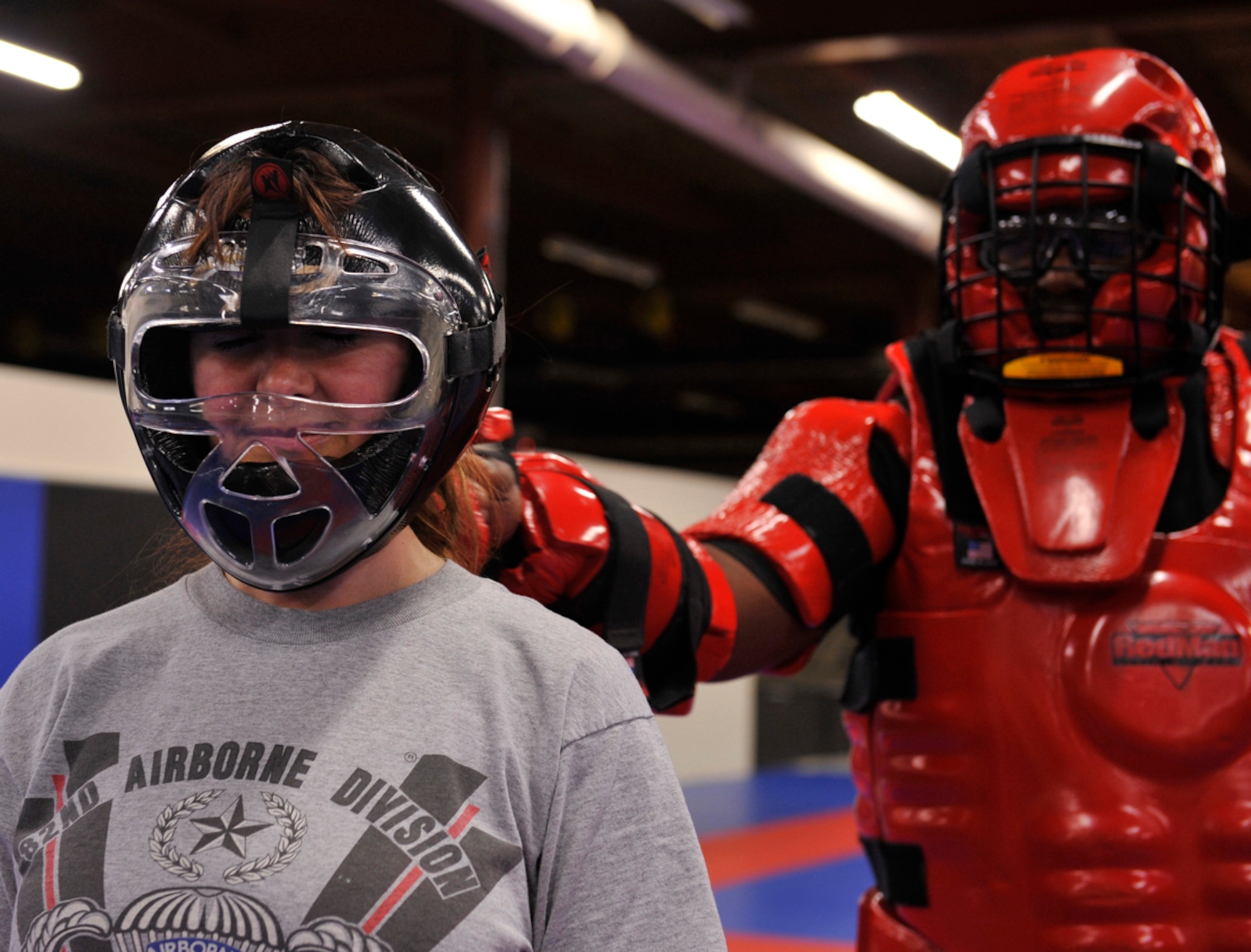 Army Maj. Bertalina Villar, Warrior Transportation Battalion operations officer, waits to defend herself from a simulated attacker, Sgt. 1st Class Tawrence Smith, a certified instructor, during the self-defense class at the Arctic Warrior Combatives Academy on Joint Base Elmendorf-Richardson Feb. 23. Women in this self-defense class were put into scenarios in which they had to figure out how to escape a possible attacker by kicking, punching or stomping. (U.S. Air Force photo/Airman 1st Class Tammie Ramsouer)