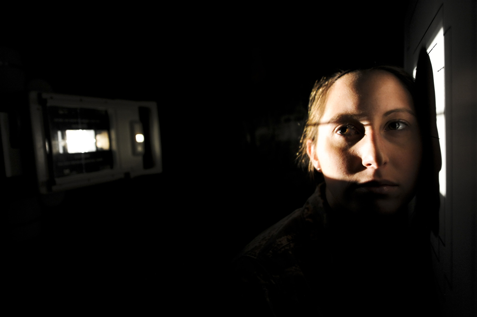 Airman 1st Class Krysta Haines, 21st Medical Support Squadron diagnostic imaging technician, allows other technicians to line up the X-ray machine for a training sinus X-ray at the 21st Medical Group clinic Feb. 18. One afternoon a month, the 21st MDG has downtime for training. The diagnostic imaging section took the time to perfect difficult X-ray positions and go over amount of radiation needed. (U.S. Air Force photo/Staff Sgt. Jacob Morgan) 