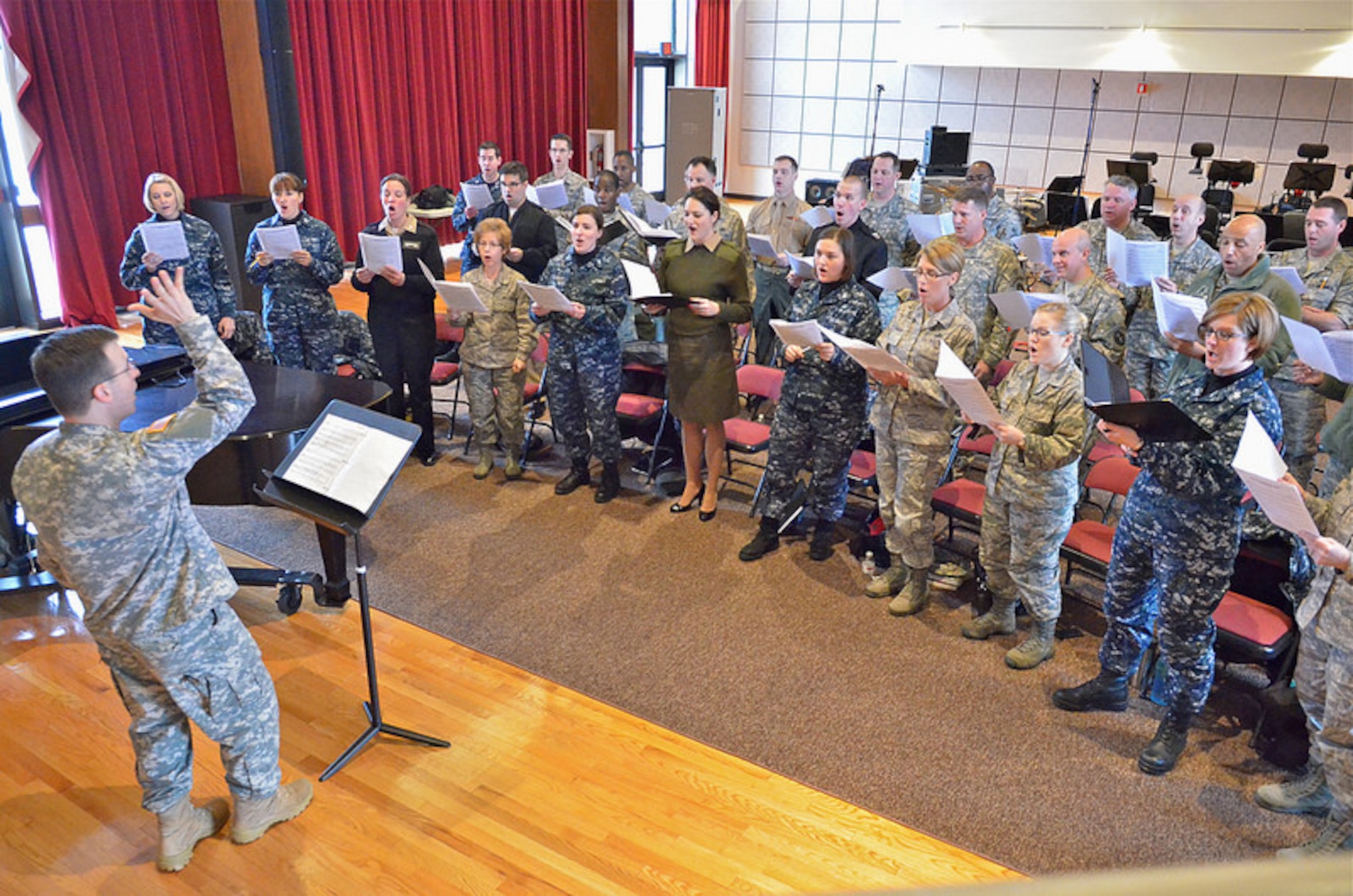Members of The United States Air Force Band's Singing Sergeants joined singers from the Army, Navy, and Marines in our studio for a rehearsal, led by Captain Curtis Kinzey, who serves as the Director of The U.S. Army Chorus.
(US Air Force photo by SMSgt Bob Kamholz/released)