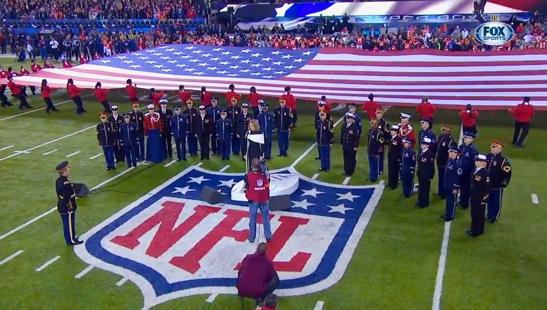 Members of The United States Air Force Band's Singing Sergeants joined singers from the Army, Navy, and Marines to perform with Renee Fleming for SuperBowl XLVIII.
(US Air Force photo/released)