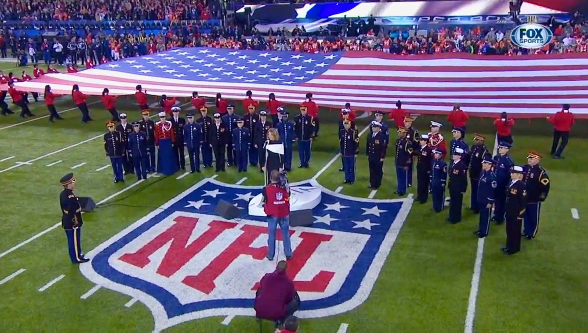 Members of The United States Air Force Band's Singing Sergeants joined singers from the Army, Navy, and Marines to perform with Renee Fleming for SuperBowl XLVIII.
(US Air Force photo/released)