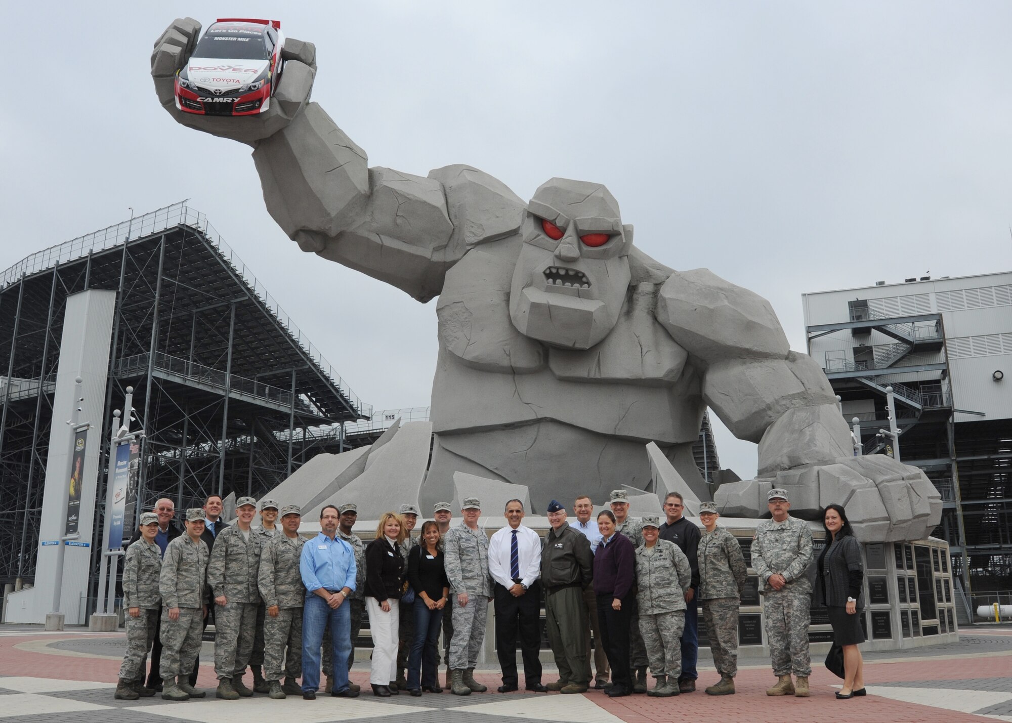 Team Dover squadron commanders and their Honorary Commanders pose in front of the Monster Mile after taking a tour of Dover International Speedway Oct. 30, 2013, in Dover, Del. Mike Tatoian, Dover Motor Sports, Inc. chief operating officer and 436th Airlift Wing honorary commander, was nominated to attend the 61st Annual National Security Forum at Maxwell Air Force Base, Ala. (U.S. Air Force photo/Staff Sgt. Elizabeth Morris)