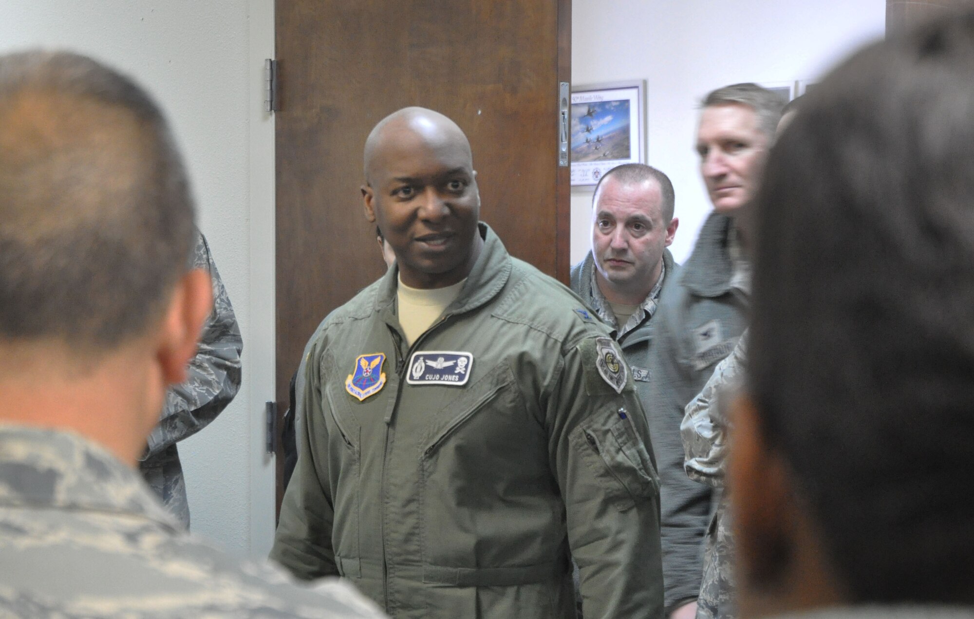 140223-F-GZ967-010 Col. Carl Jones, 90th Missile Wing vice commander, speaks to the Force Improvement Program team after their arrival Feb. 23. Jones welcomed the team to Warren as they prepared for the last rounds of interviews here. (U.S. Air Force photo by Airman 1st Class Brandon Valle)