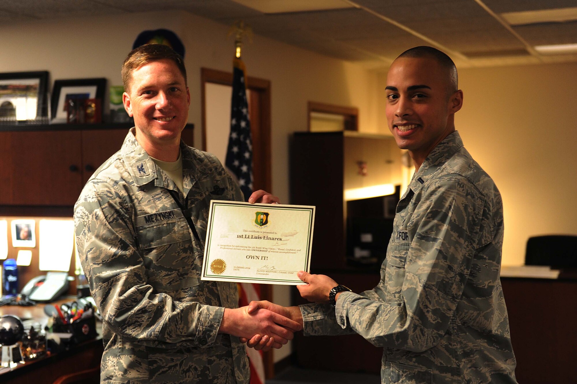 1st Lt. Luis Linares, 5th Force Support Squadron & Tech. Sgt. Andrea Regina, 5th Mission Support Group, have epitomized the 5 BW/CC’s vision of mission ownership.  They quickly and efficiently distributed Force Management eligibility rosters to wing leadership, affecting 2,804 Team Minot members across 36 units within 24-hours.  Furthermore, these professionals hosted 23 town hall meetings within 5 days to educate military and civilian personnel, including spouses, on the FY14 Force Management Programs, making Minot the first base in the command to launch this initiative.  During this period, 1,058 personnel were informed and armed with tools to make time-sensitive career decisions.  Additionally, by leveraging technology, the Q&A information gathered from the town hall briefings was posted on the 5 FSS Minot MPS SharePoint page via Air Force Portal, accessible to all Team Minot personnel, at home station and deployed.  The feedback and questions gathered from the town halls were then forwarded and answered by AFPC and later utilized to update Force Management program guidance Air Force-wide.  Lt. Linares and Tech. Sgt. Regina have undoubtedly simplified a difficult and complex program for Airmen across the wing, solidifying the 5th Bomb Wing’s vision of mission ownership. (U.S. Air Force photos/ Airman 1st Class Lauren Pitts)
