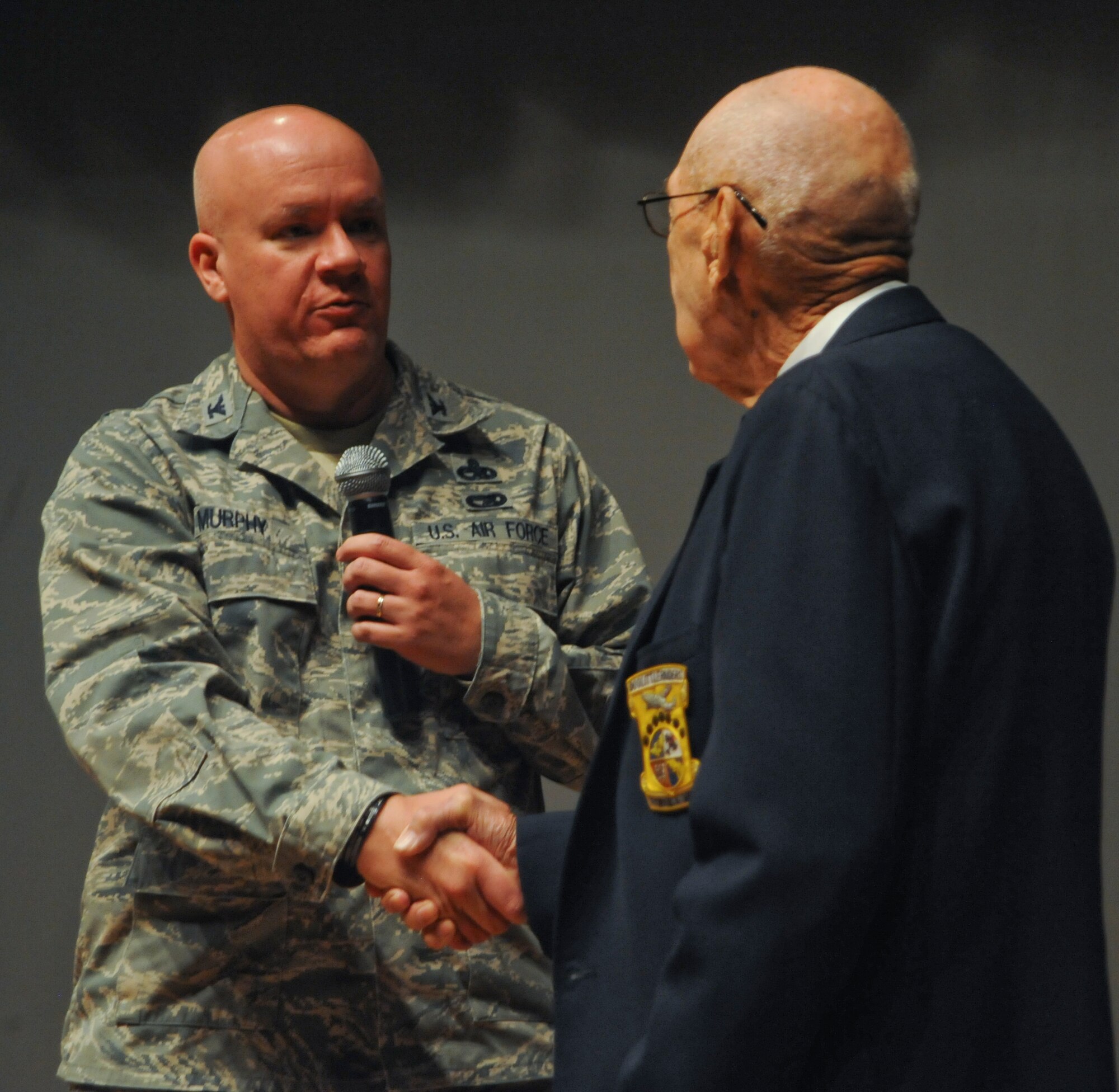 U. S. Air Force Col. Mark Murphy, 355th Maintenance Group commander, thanks retired Lt. Col. Richard “Dick” Cole, a Doolittle Raider, for volunteering his time to provide insight on the Doolittle Raid at Davis-Monthan Air Force Base, Ariz., Feb. 24, 2014. The Doolittle Raid, April 18, 1942, was the United States’ first air retaliation for the attack on Pearl Harbor. (U.S. Air Force photo by Senior Airman Sivan Veazie/Released)
