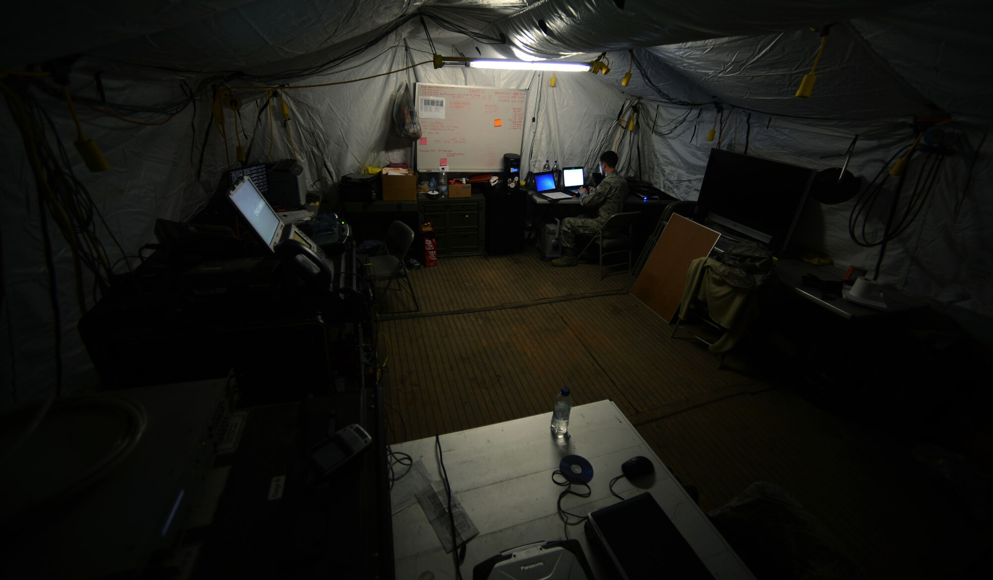 Airman 1st Class Joseph Wrobel, 1st Combat Communications Squadron tactical network operations technician, processes a user account request Feb. 25, 2014, in the deployed 1st CBCS compound at Souda Bay, Greece. The 11-personnel team established connections between the ground, skies and cyber domain within a matter of days for the bed-down of the 494th Expeditionary Fighter Squadron, which is not only completing readiness requirements, but also providing an avenue to expand strategic and operational ties with the Hellenic Air Force. (U.S. Air Force photo by Staff Sgt. Thomas Trower)