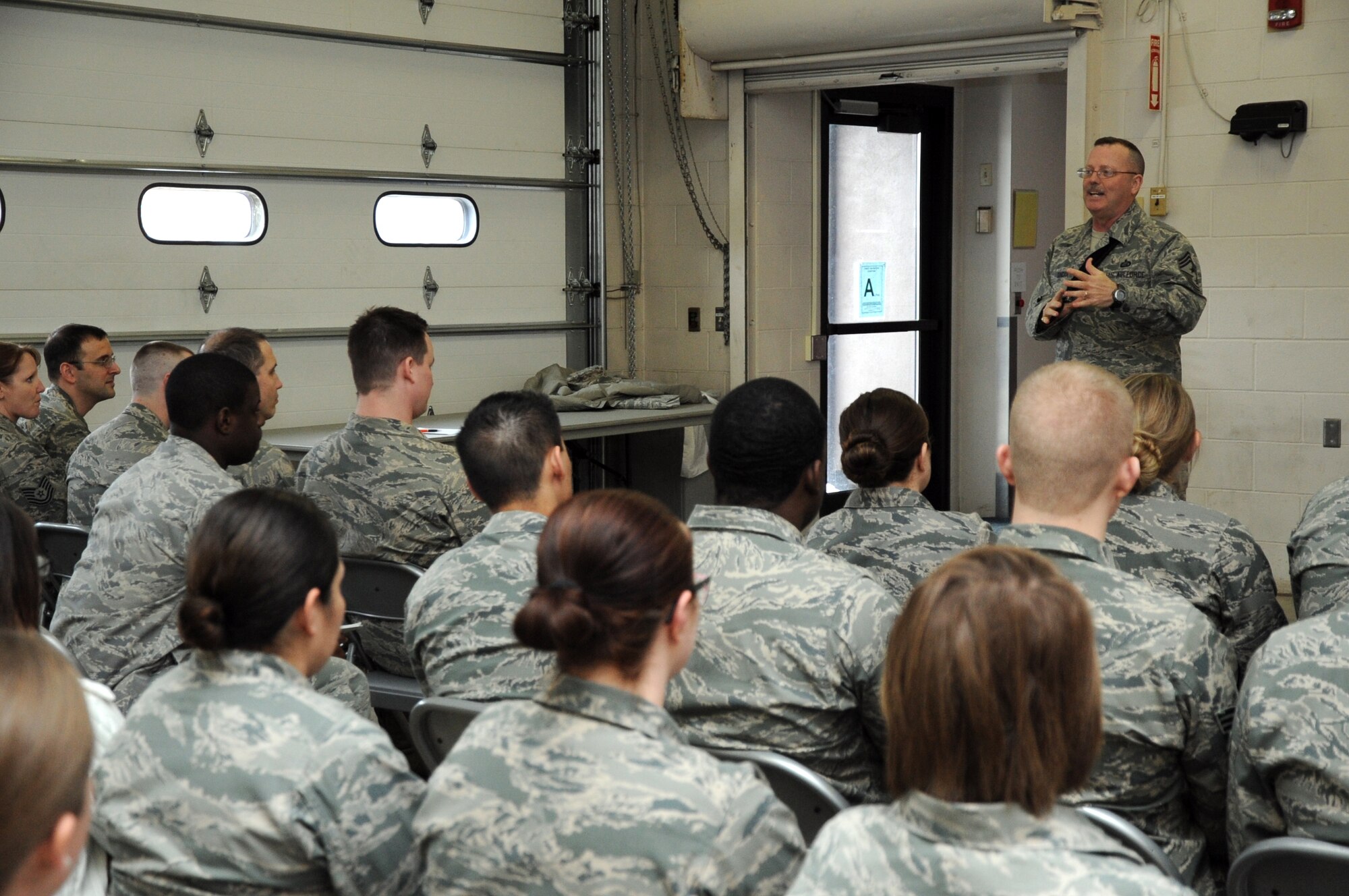 Chief Master Sgt. David Duncan, 319th Air Base Wing command chief, speaks to Airmen of the 319th Medical Group on Grand Forks Air Force Base, N.D., Feb. 24, 2014. Duncan spoke about leadership as part of a newly revamped professional development program at the 319th MDG. (U.S. Air Force photo/Staff Sgt. David Dobrydney)