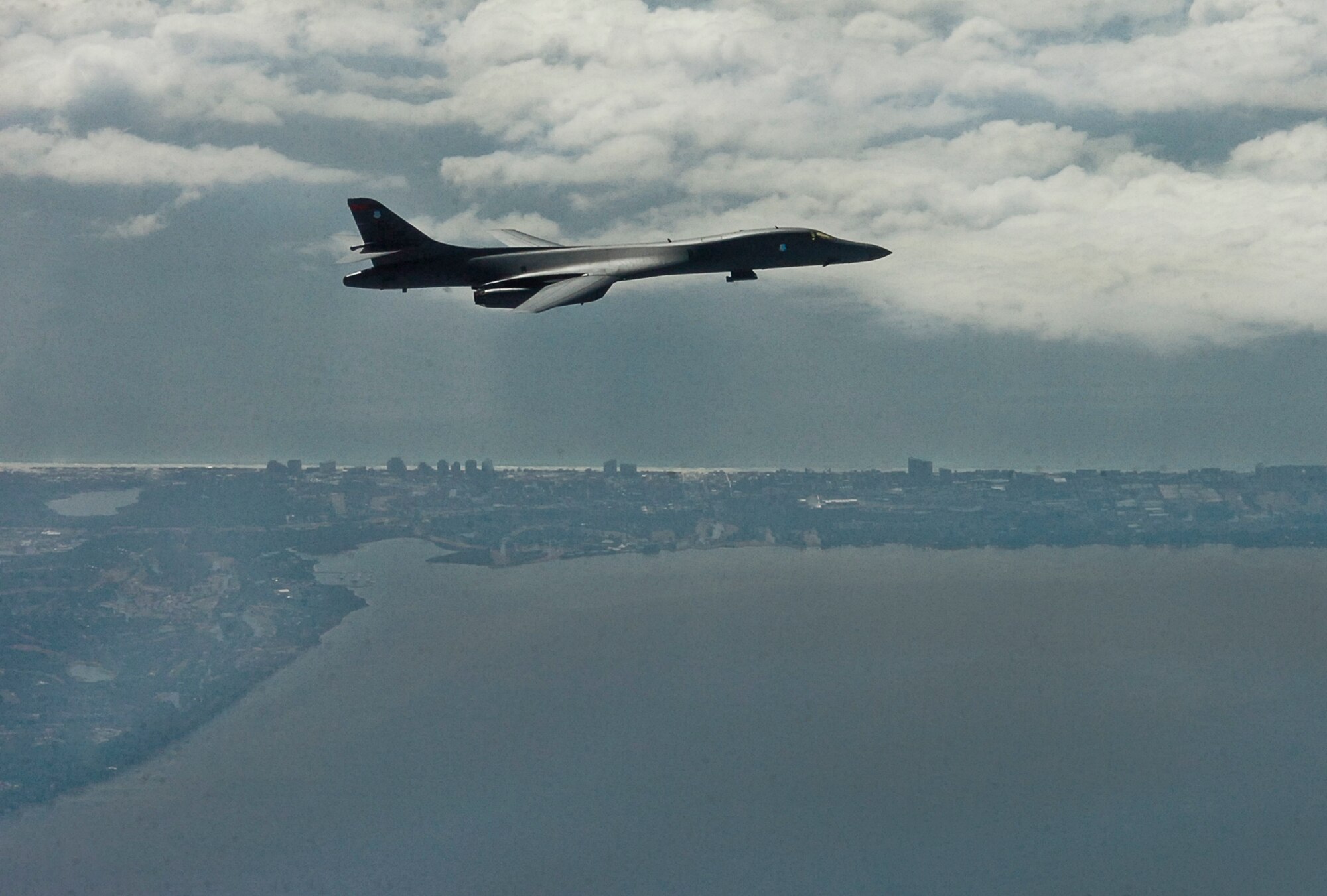 A B-1 Lancer from the 28th Bomb Wing soars over the Emerald Coast near Eglin Air Force Base, Fla., Feb. 18. The B-1 from Ellsworth Air Force Base, S.D., participated in the week-long weapon system evaluation program mission known as Combat Hammer, in which it released air-to-ground munitions. The Combat Hammer WSEP program is managed by the 86th Fighter Weapons Squadron, part of the 53rd Wing.  (Courtesy photo)