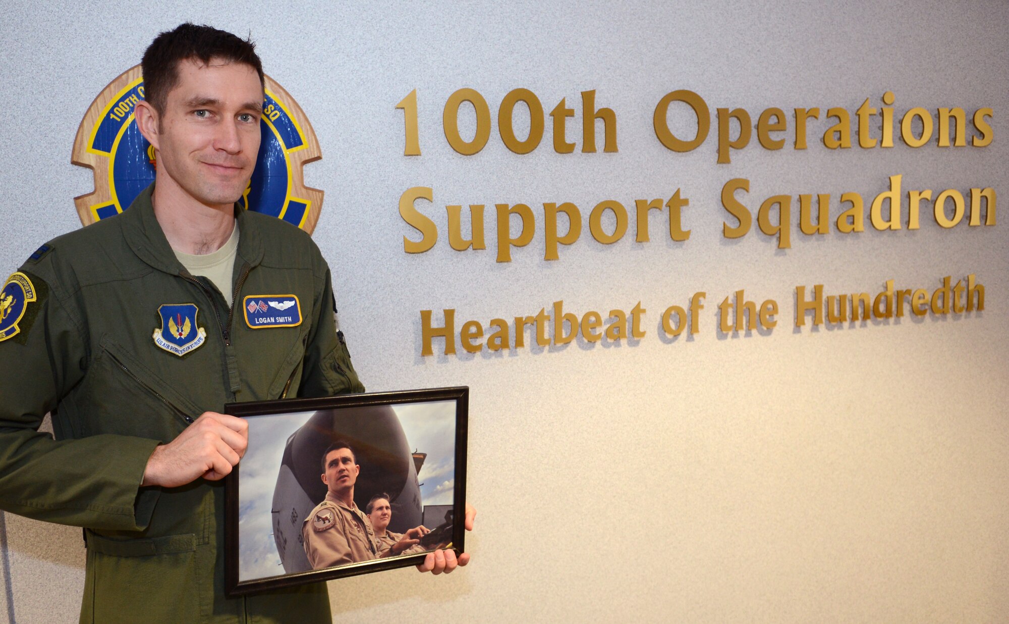U.S. Air Force Capt. Logan Smith, 100th Operations Support Squadron chief executive officer from Ephrata, Wash., holds a photo of himself from a 2012 deployment to Manas Air Base Feb. 25, 2014, on RAF Mildenhall, England. Smith flew air refueling missions in support of operations in the Middle East during his deployment. Manas Air Base flew its last air refueling mission Feb. 24, 2014. (U.S. Air Force photo by Airman 1st Class Dillon Johnston/Released)