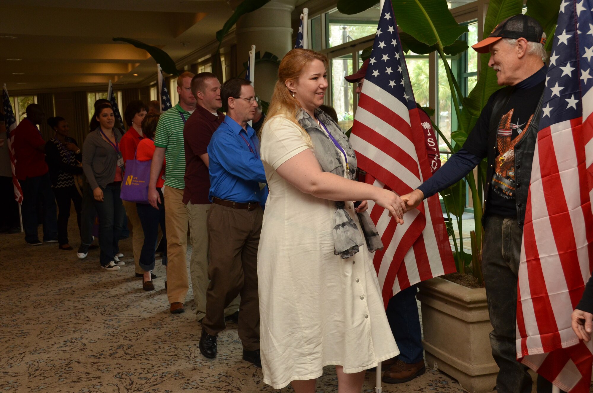Patriot Guard members shake hands with everyone as they exit the Yellow Ribbon Reintegration Program, Hilton Head, S.C., February 23, 2014 (U.S. Air Force photo/SSgt. Kelly Goonan)