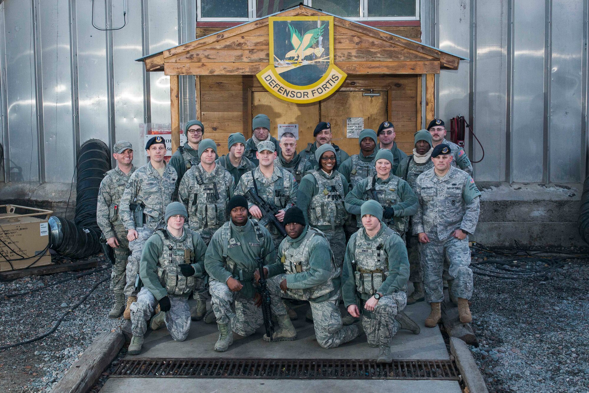 Members of the 376th Expeditionary Security Forces at Transit Center at Manas, Kyrgyzstan, including Airmen representing the 908th Airlift Wing,pose for a group photo. (U.S. Air Force photo/Senior Airman George Goslin)
