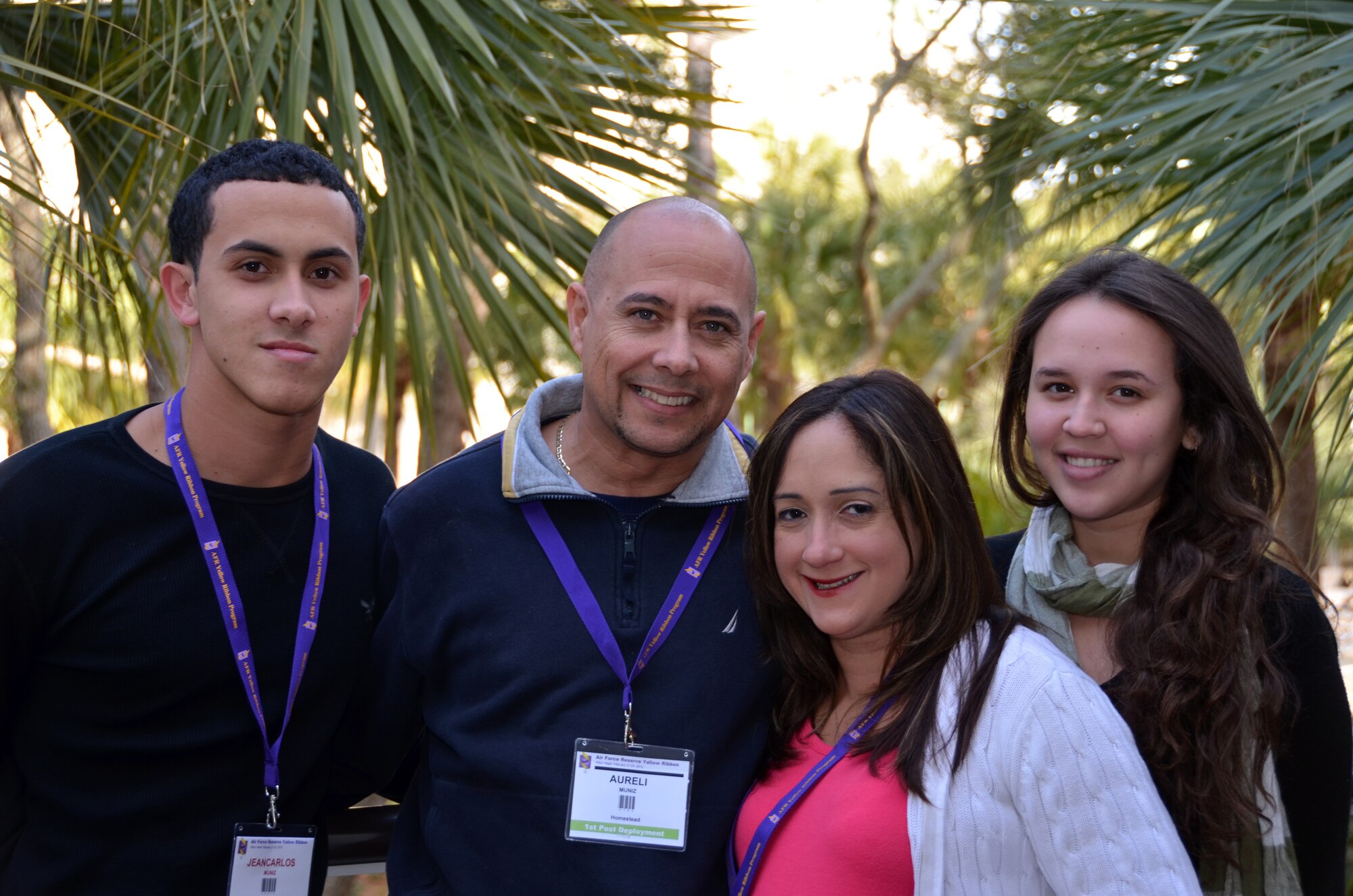 TSgt. Aureli Muniz poses with his family during the Yellow Ribbon Reintegration Program, Hilton Head, S.C., February 22, 2014 as part of a demonstration. (U.S. Air Force photo/SSgt. Kelly Goonan)