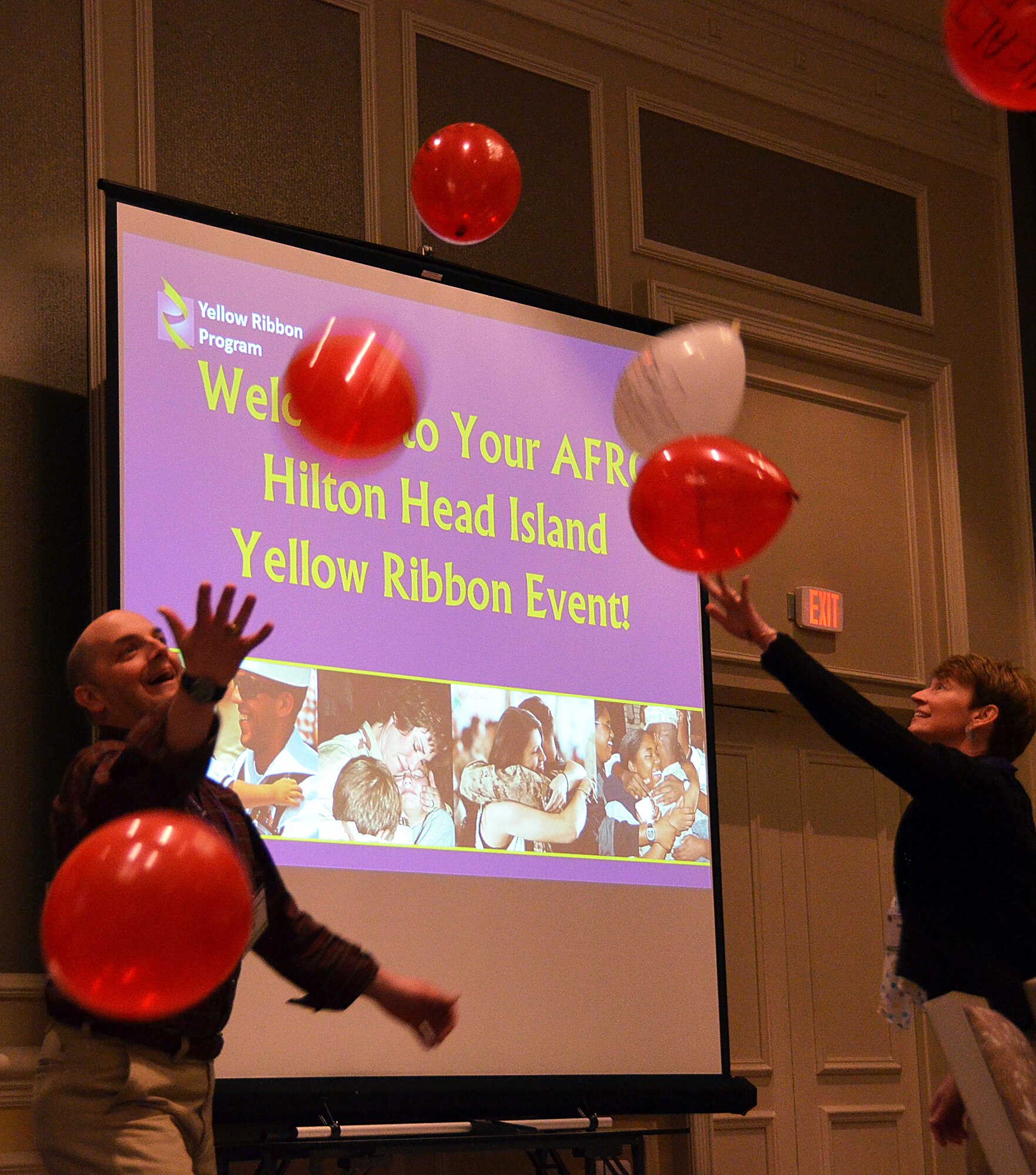 Lt. Col. Patrick Dufraine and his spouse juggle "lifes struggles" balloons during the Yellow Ribbon Reintegration Program, Hilton Head, S.C., February 22, 2014 as part of a demonstration. (U.S. Air Force photo/SSgt. Kelly Goonan)