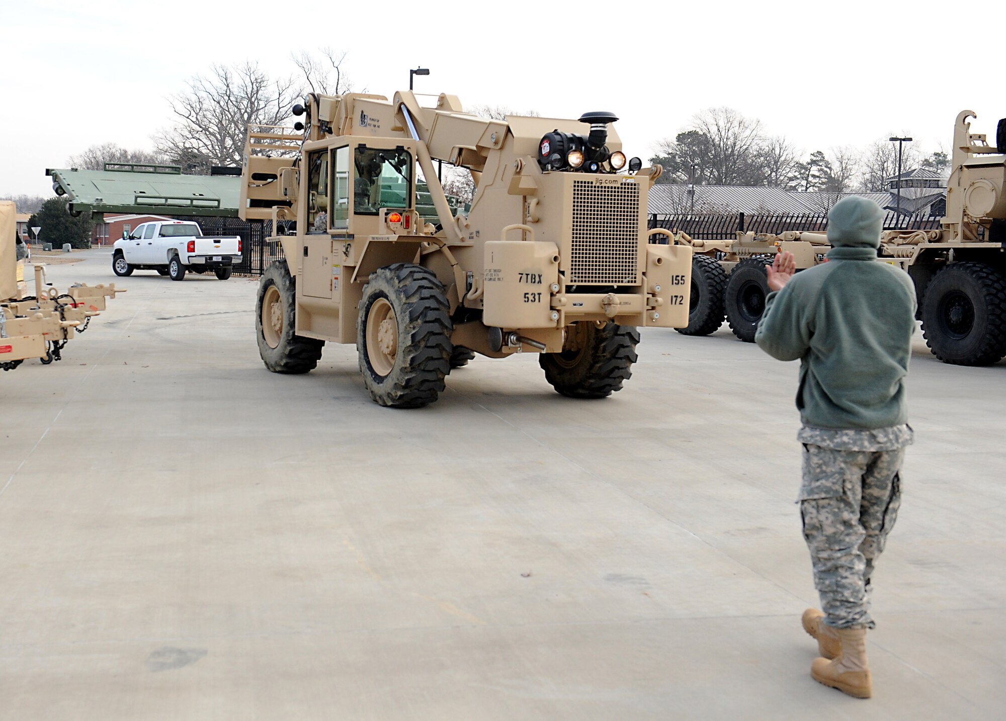Soldiers assigned to the 155th Inland Cargo Transfer Company, 7th Sustainment Brigade (Expeditionary), prepare to load a steel pallet during a Joint Task Force Civil Support deployment readiness exercise at Fort Eustis, Va., Feb. 11, 2014. JTF-CS tested the unit’s ability to rapidly respond, within two hours of notification, to a catastrophic man-made or natural event in the U.S. JTF-CS anticipates, plans, and prepares for Chemical, Biological, Radiological, and Nuclear Defense Support of Civil Authorities (CBRN-DSCA) response operations. (DOD photo by U.S. Navy Petty Officer 1st Class Brian Dietrick/Released)